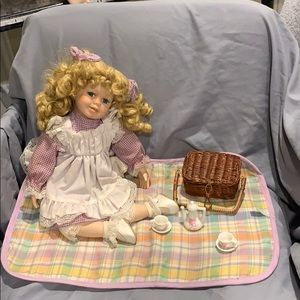 Porcelain doll girl on a picnic